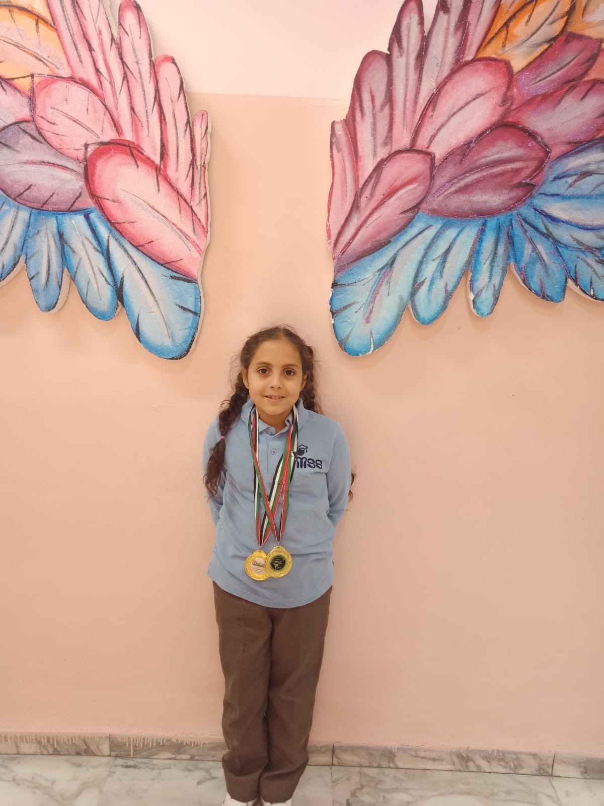 الميدالية الذهبية للطالبة زينة القيسي من مدارس النظم الحديثة